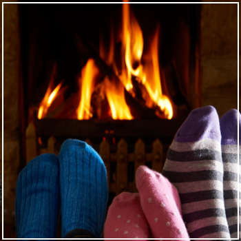 warming feet by the fireplace 