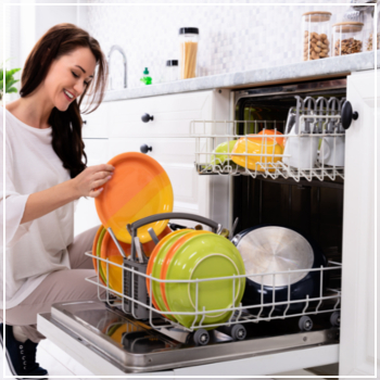 woman unloading dishwasher