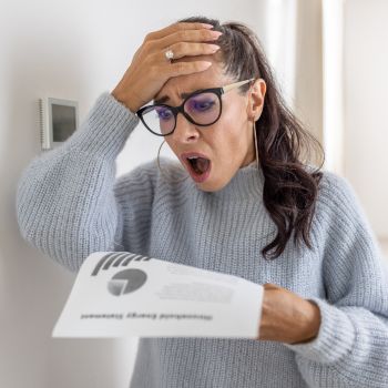 woman shocked by rising energy costs